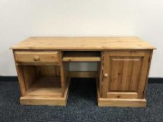 A pine twin pedestal PC desk