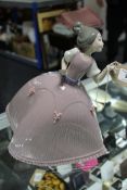 A Lladro figure - girl in pink dress CONDITION REPORT: Tip of rose bud in girl's