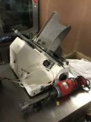 A meat slicer and a commercial hand mixer