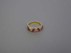 An 18ct gold ruby and diamond ring