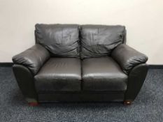 A pair of brown leather two seater settees