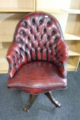 A red button leather Chesterfield office armchair a/f CONDITION REPORT: Please note
