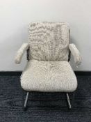 Three mid 20th century beech and tubular metal armchairs