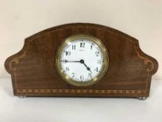 An inlaid mahogany eight day mantel clock