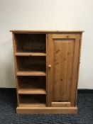 A pine child's wardrobe fitted with shelves