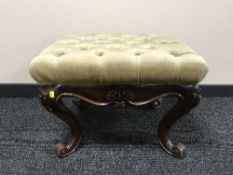 A mahogany dressing table stool in green button fabric