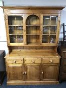A pine glazed door kitchen dresser