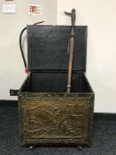 A large brass embossed coal box and a copper and brass bed warmer