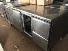 A stainless steel refrigerated storage counter