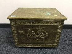 A brass embossed coal box