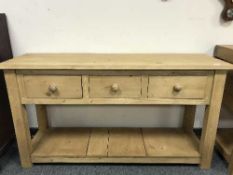 A reclaimed pine three drawer dresser base