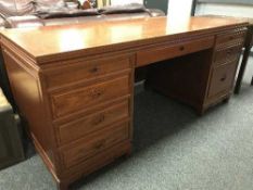A large oriental style twin pedestal desk,