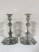 A pair of George II style silver candlesticks, William Hutton & Sons Ltd, London 1910, with sconces,