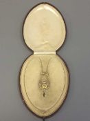 An Edwardian 9ct gold peridot, seed pearl and citrine pendant on chain, chain length 39.