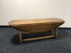 A Chapmans Siesta yewwood drop leaf coffee table