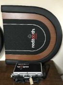 A Red Tooth poker table and chips in carry bag