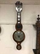 A Victorian inlaid banjo barometer with silvered dial