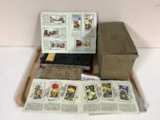A tray of Will's cigarette cards, album of cigarette silks, two volumes The Great War,