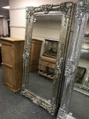 A large silvered bevelled mirror