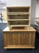 A pine entertainment stand and pine blanket box