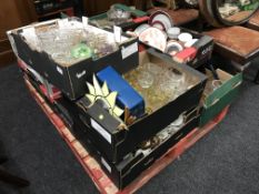 A pallet of twelve boxes of assorted glass ware, tea china, dinner ware,