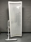 An Elite sun bed canopy on trolley