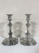 A pair of George II style silver candlesticks, William Hutton & Sons Ltd, London 1910, with sconces,