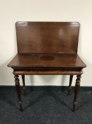 A Victorian mahogany tea table