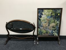 A mahogany dressing table mirror and an oak tapestry fire screen