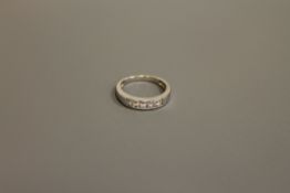 An 18ct white gold five stone diamond ring, approximately 0.35ct, size H.