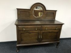 An oak mirror backed sideboard
