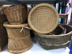 A pair of wicker stools, carpet beaker, bicycle basket,