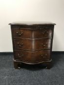 An early Victorian bow-fronted three drawer chest