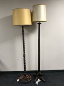 An oak standard lamp with shade and one other