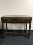 An early 20th century oak side table