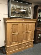 A triple door child's wardrobe fitted two drawers