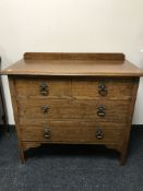 An Edwardian oak three drawer chest