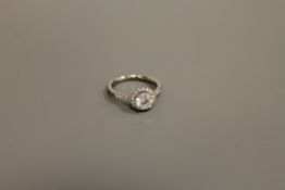 An 18ct white gold diamond ring in halo setting,