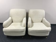 A pair of Marks & Spencers armchairs in beige fabric