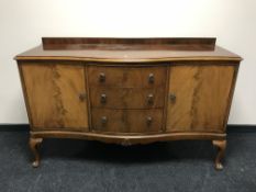 A mahogany serpentine fronted sideboard