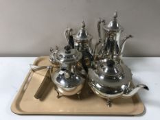 A tray of plated tea service,