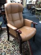 A beech framed tan leather armchair
