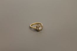 An 18ct gold diamond cluster ring, the central stone estimated at 0.