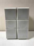 A pair of Bang and Olufsen Beovox CX1000 speakers