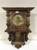 A continental walnut cased wall clock
