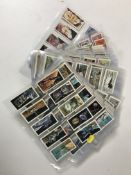 A collection of assorted tea cards in plastic wallets