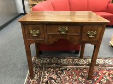 A Georgian walnut low boy