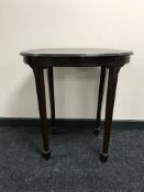 An oval mahogany occasional table