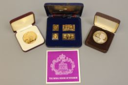 A silver stamp set, The Historic Coronation Stamps of the Four Windsor Monarchs,