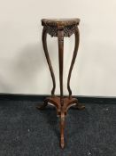 A reproduction mahogany plant stand